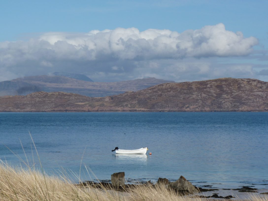 Small boat anchored in sea